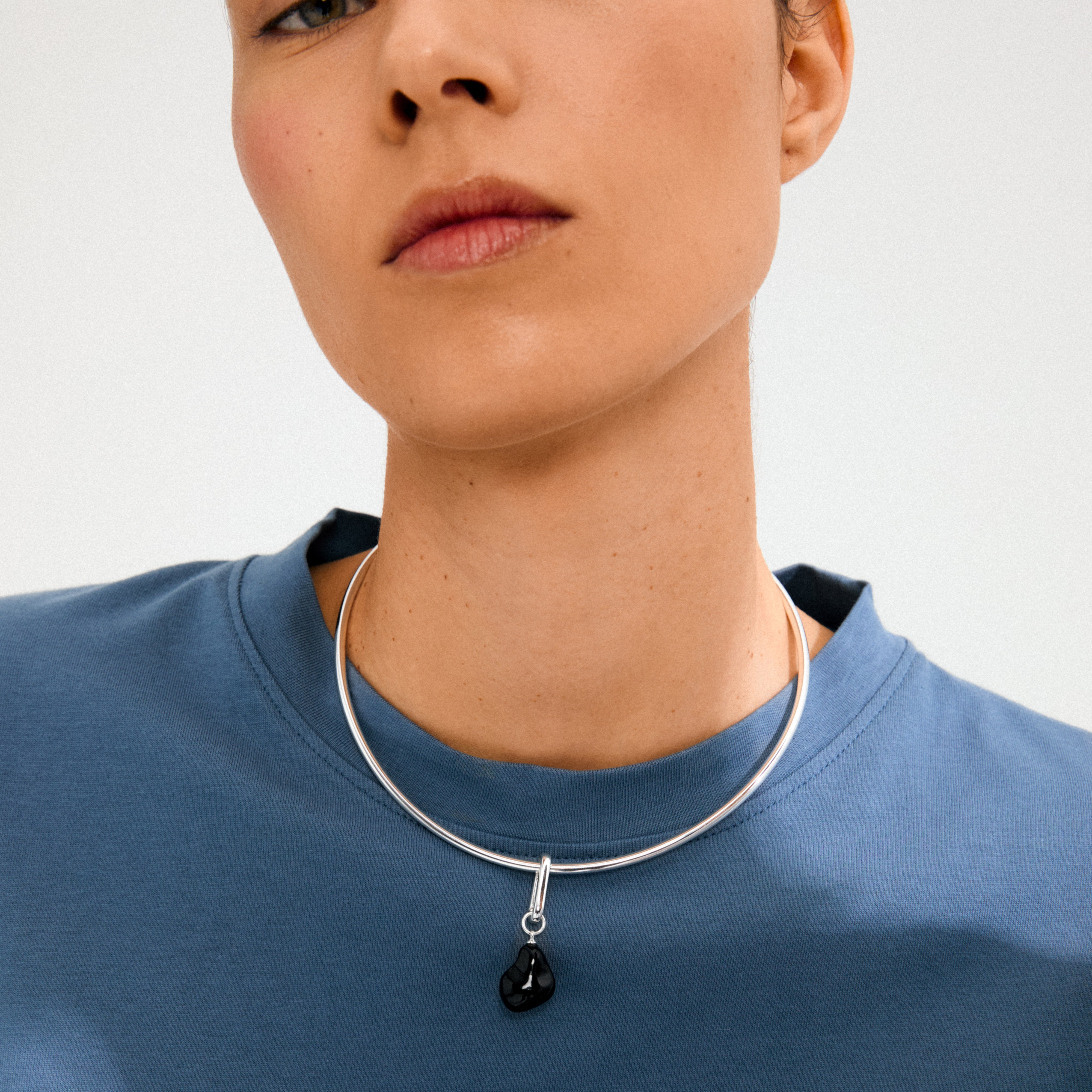 Silver-plated CHARM mold pendant on a round choker with a black teardrop pendant, showcasing Pilgrim's boho style and eco-friendly craftsmanship.